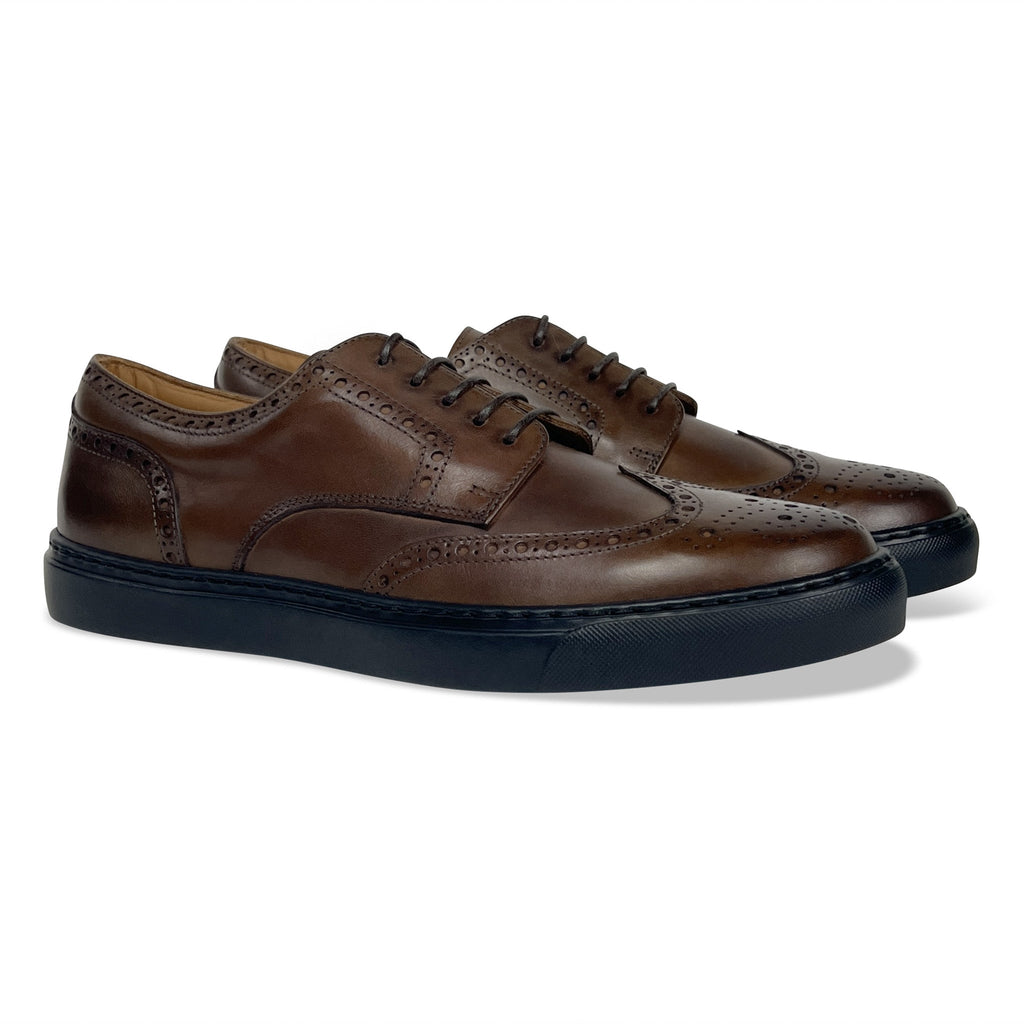 Men's brown wingtip oxford shoes with lace-up brogue panels and dark rubber sole