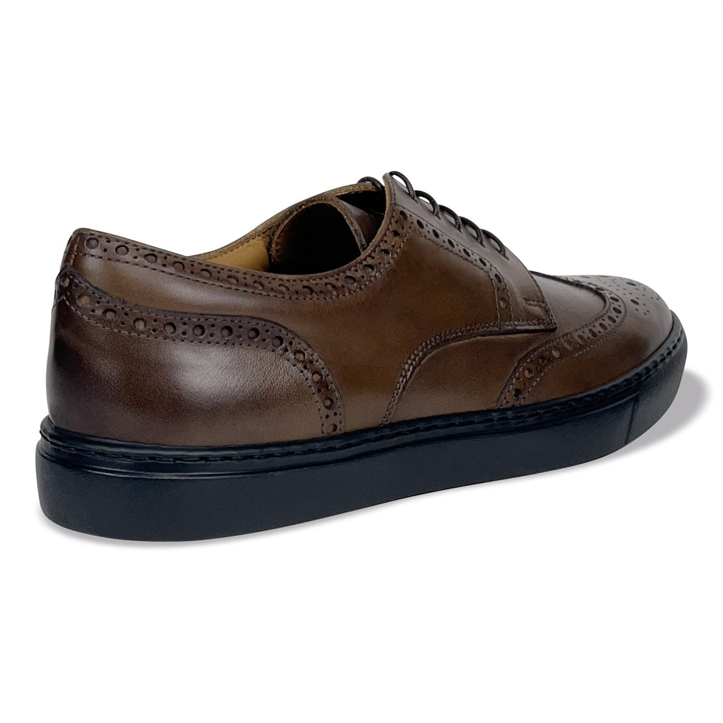Men's brown wingtip oxford shoes with lace-up and perforated detailing