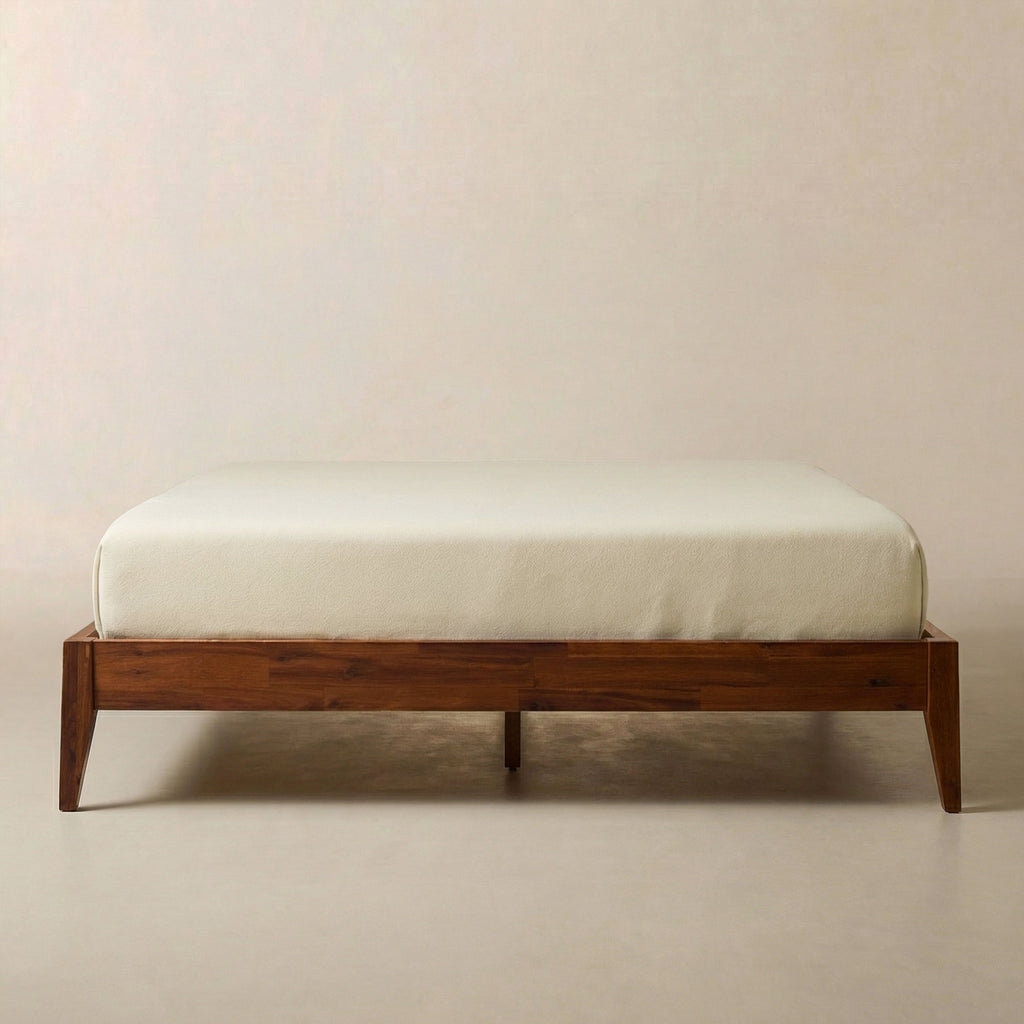 Brown wooden bed frame with slatted platform, no headboard visible