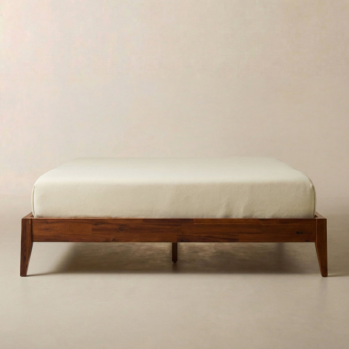 Brown wooden bed frame with slatted platform, no headboard visible
