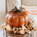 Metal pumpkin container with removable lid, embossed orange texture and leaf accents