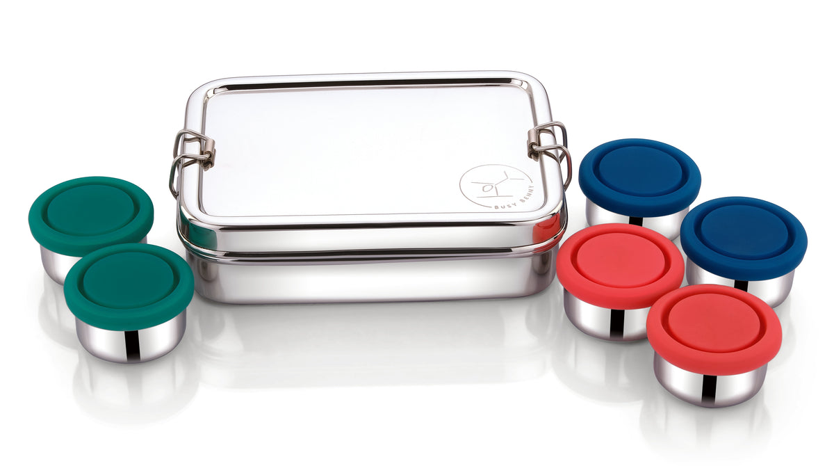 Stainless steel bento snack box with six small colored containers with snap lids