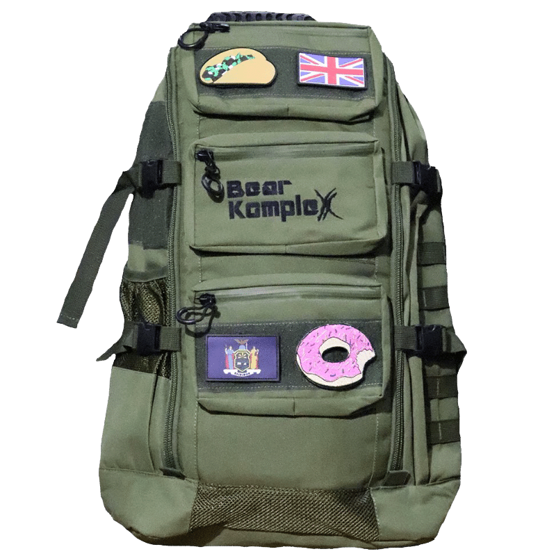 Military backpack in military green with front pockets, straps, and patch panels
