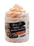 Peach-toned whipped soap and shave cream in clear jar, front label
