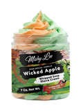 Whipped soap and shave cream tub with pastel green, orange, and peach swirl topping.