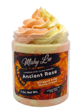 Whipped soap and shave cream in clear jar with orange and yellow swirl top