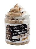 Whipped soap and shave cream jar with beige and white whipped swirls inside clear lid