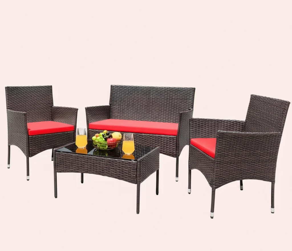 Dark brown wicker patio conversation set with red seat cushions, sofa, two chairs, coffee table