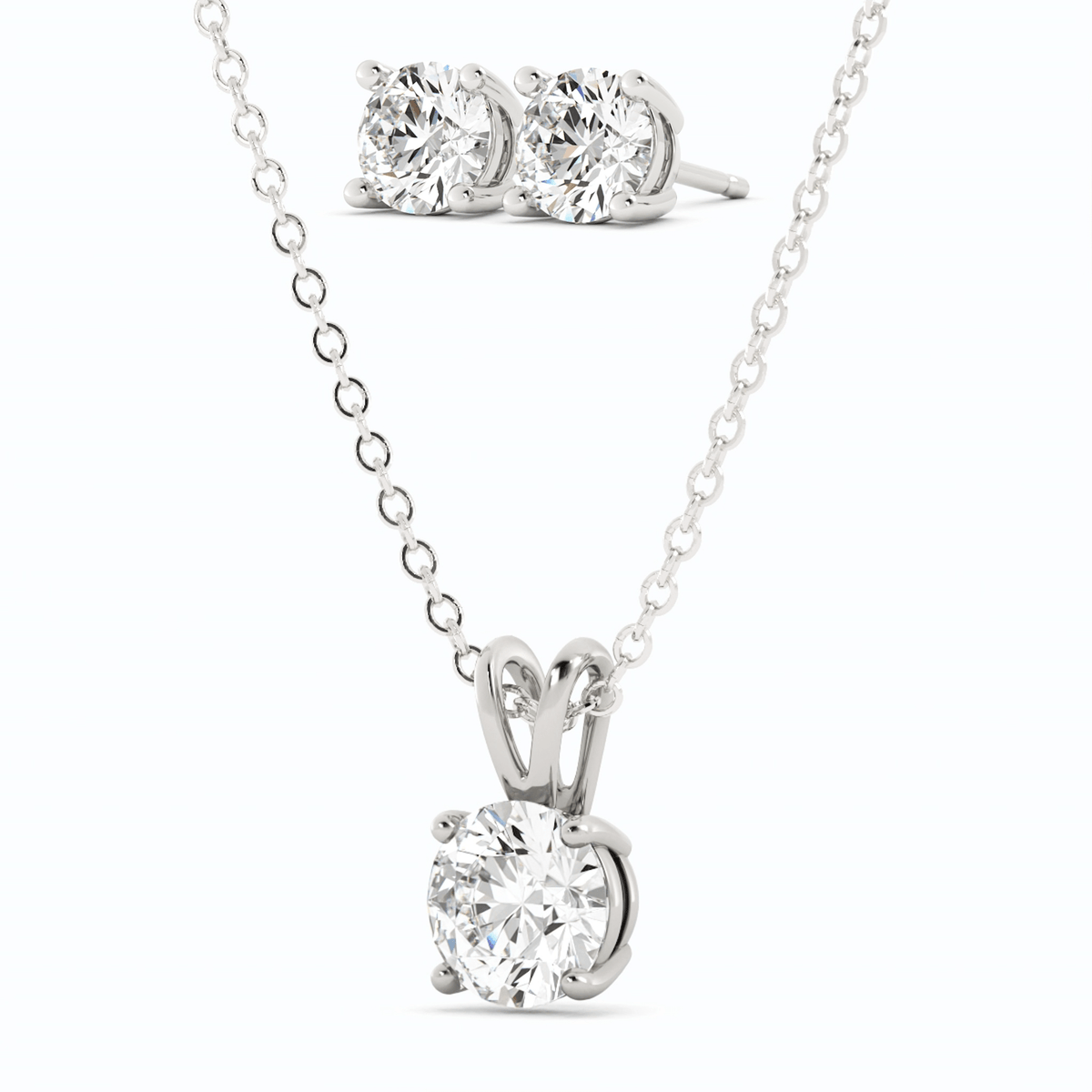 Round moissanite pendant with chain and two matching stud earrings, white gold overlay
