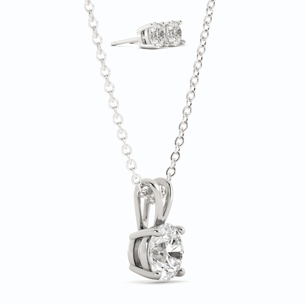 Moissanite pendant with round center stone and matching stud earrings, white gold overlay