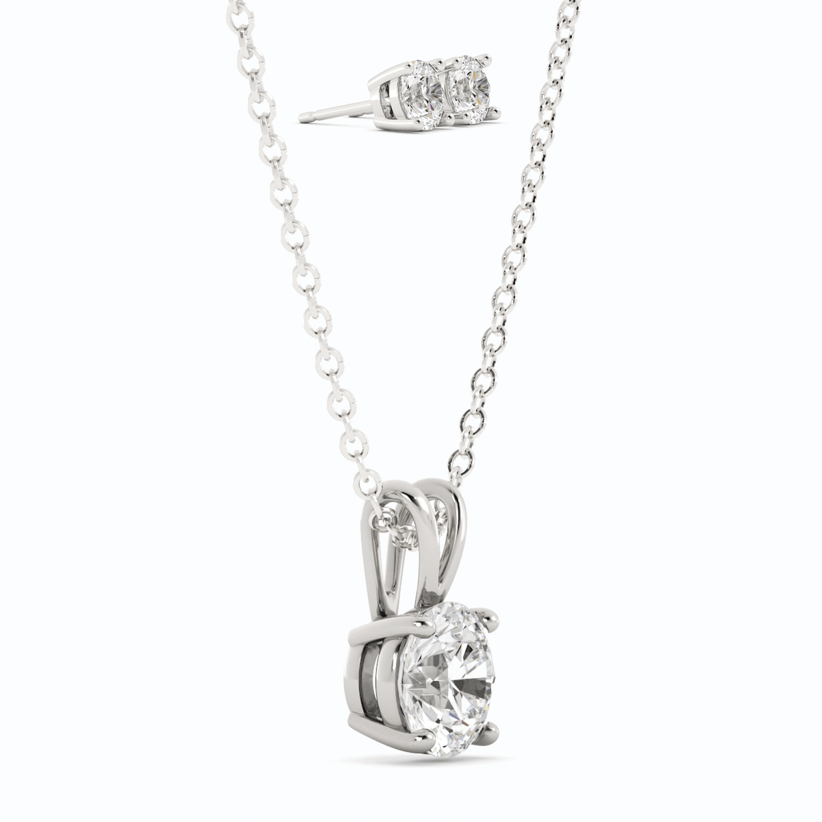 Moissanite pendant with round center stone and matching stud earrings, white gold overlay