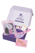 Open RoseRelief™ recovery gift set with mini bottles, floral tissue, thank-you card