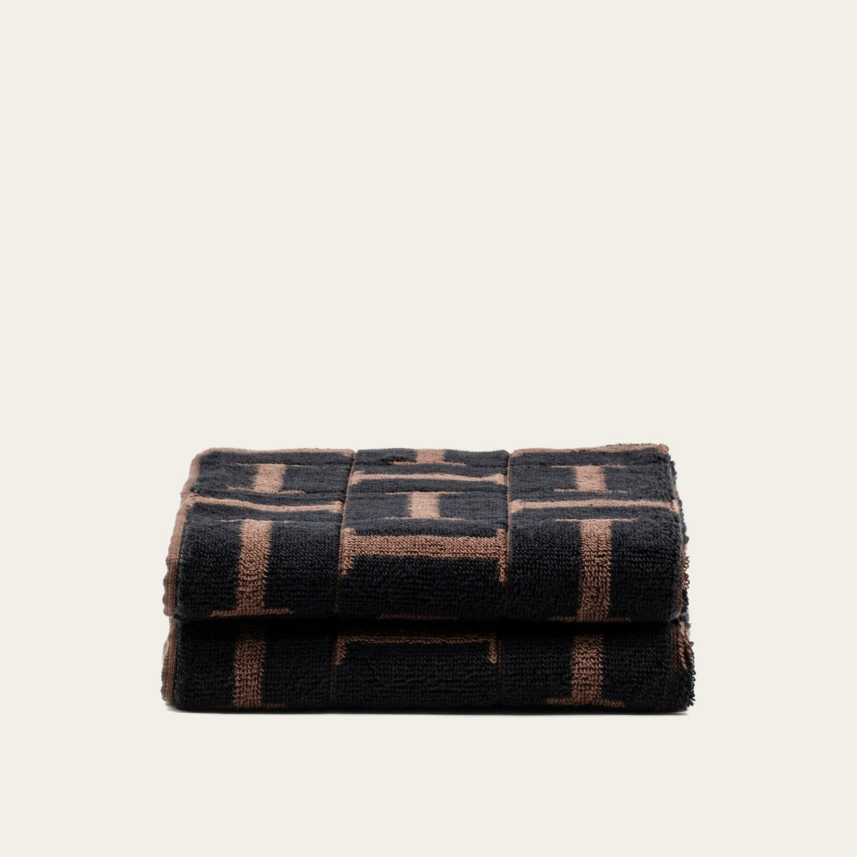 Fleece terry cotton towels, tobacco and black woven check pattern, folded stack of 2 layers