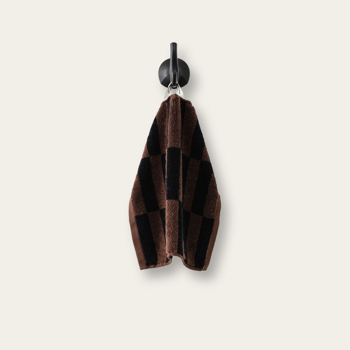Hanging hand towel with tobacco brown and black plaid pattern