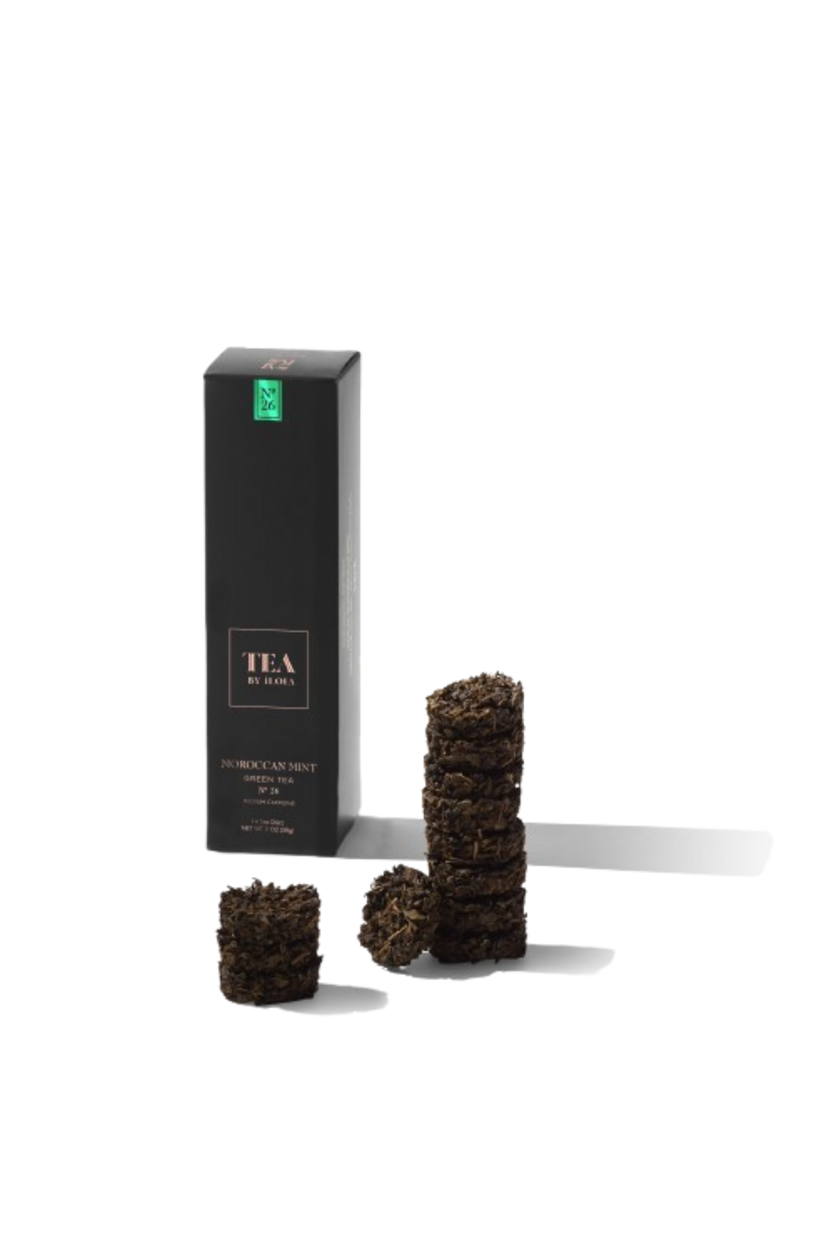 Moroccan mint tea discs beside a tall black tea box