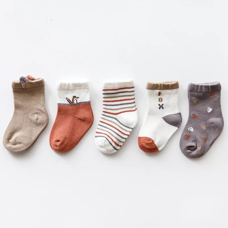 Toddler 5-pack crew socks featuring fox designs, stripes, and solid colors in neutral tones