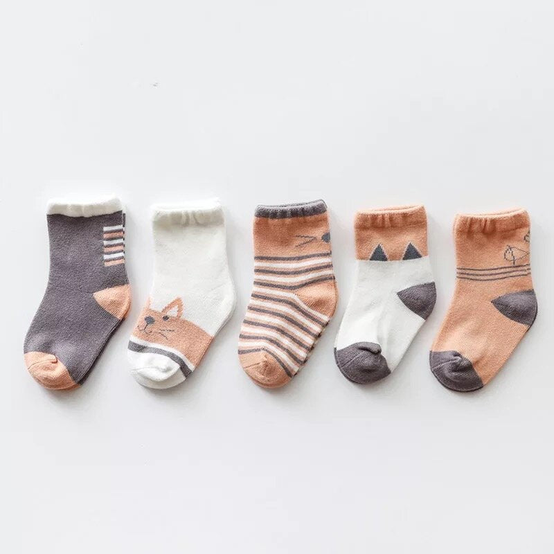 Kids' socks assortment: white, gray, and peach pairs with cat motifs and stripes