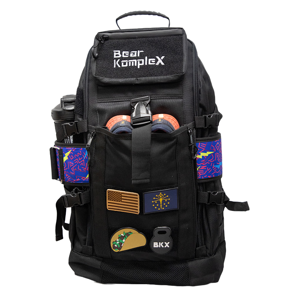 Black tactical backpack front view with organizer pockets and colorful side panels