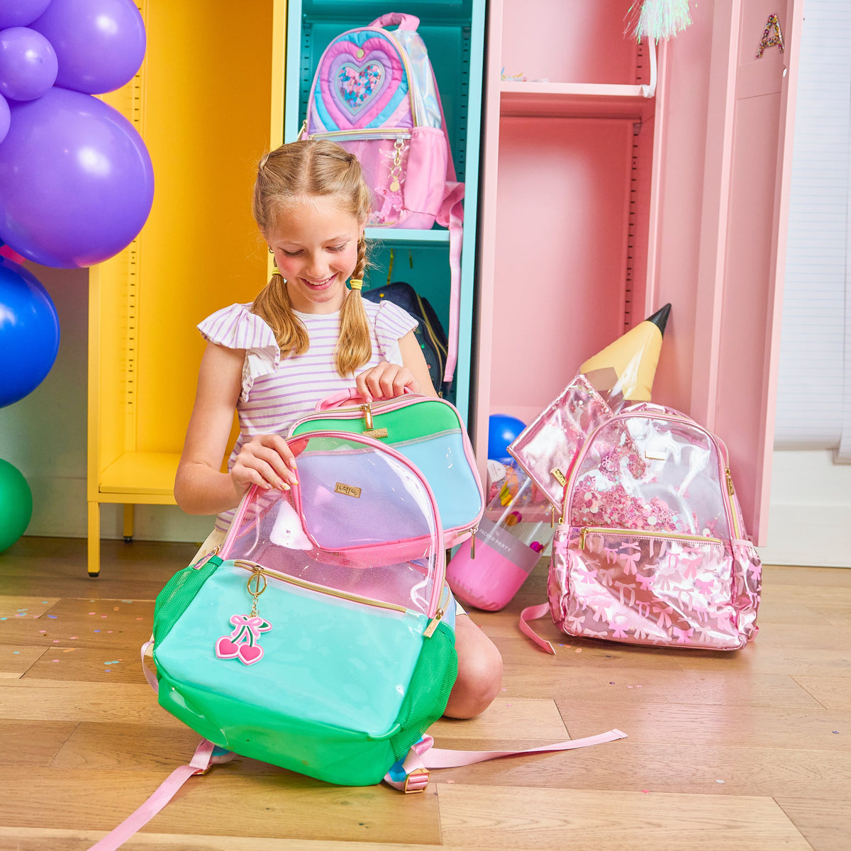 Clear jelly color block backpack with pink, teal, and green compartments and zipper