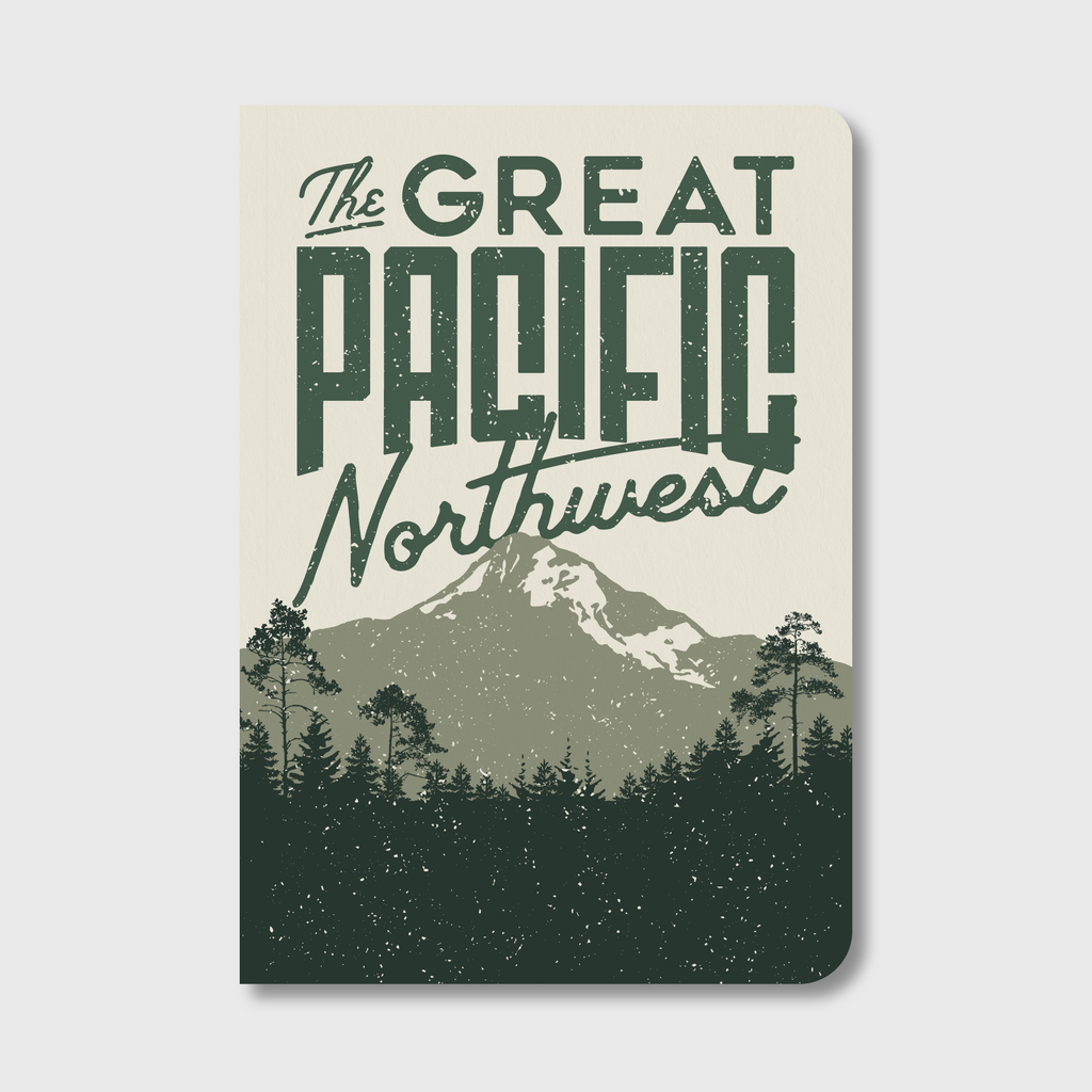 PNW notebook with green mountain and evergreen illustrated cover