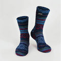 Kids' fleece socks in navy with zigzag Nordic pattern and red/green stripes