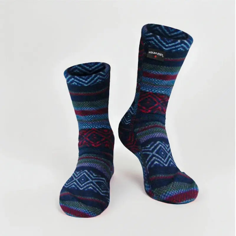 Kids' fleece socks in navy with zigzag Nordic pattern and red/green stripes