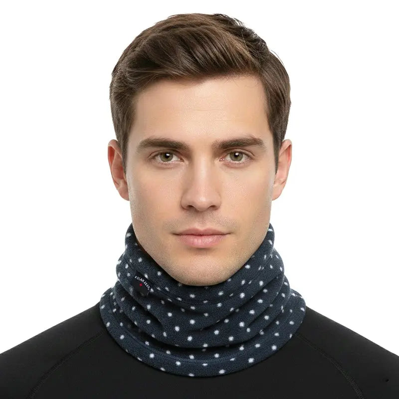 Fleece neck warmer in dark navy with white dot pattern, worn around the neck.