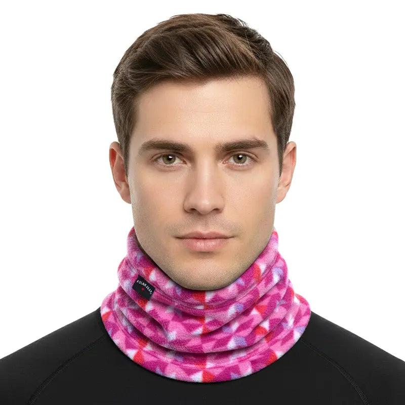 Fleece neck warmer on model: bright pink geometric fleece for cold-weather coverage