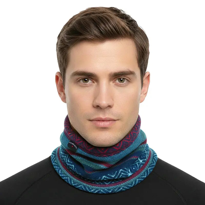 Fleece neck warmer in blue patterned fabric, worn around the neck as a loop.