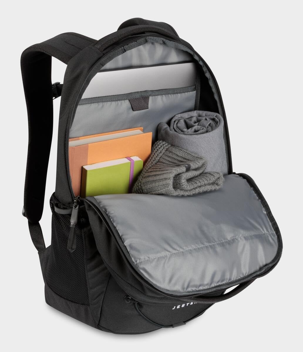Jester laptop backpack, black with open interior showing books and folded blanket