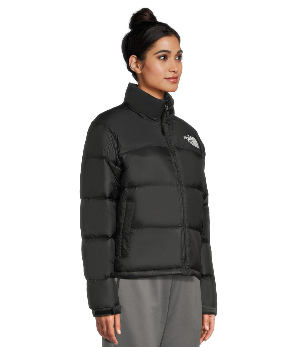 Women’s black puffer jacket with high collar, front zip, sleeve logo