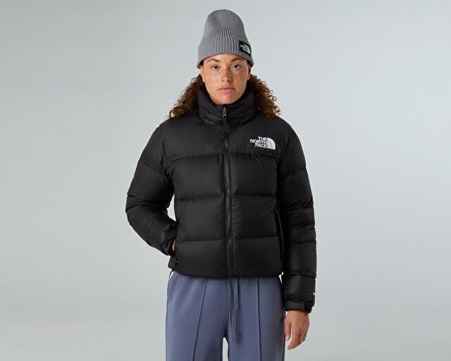 Women’s black quilted puffer jacket with stand collar and The North Face logo