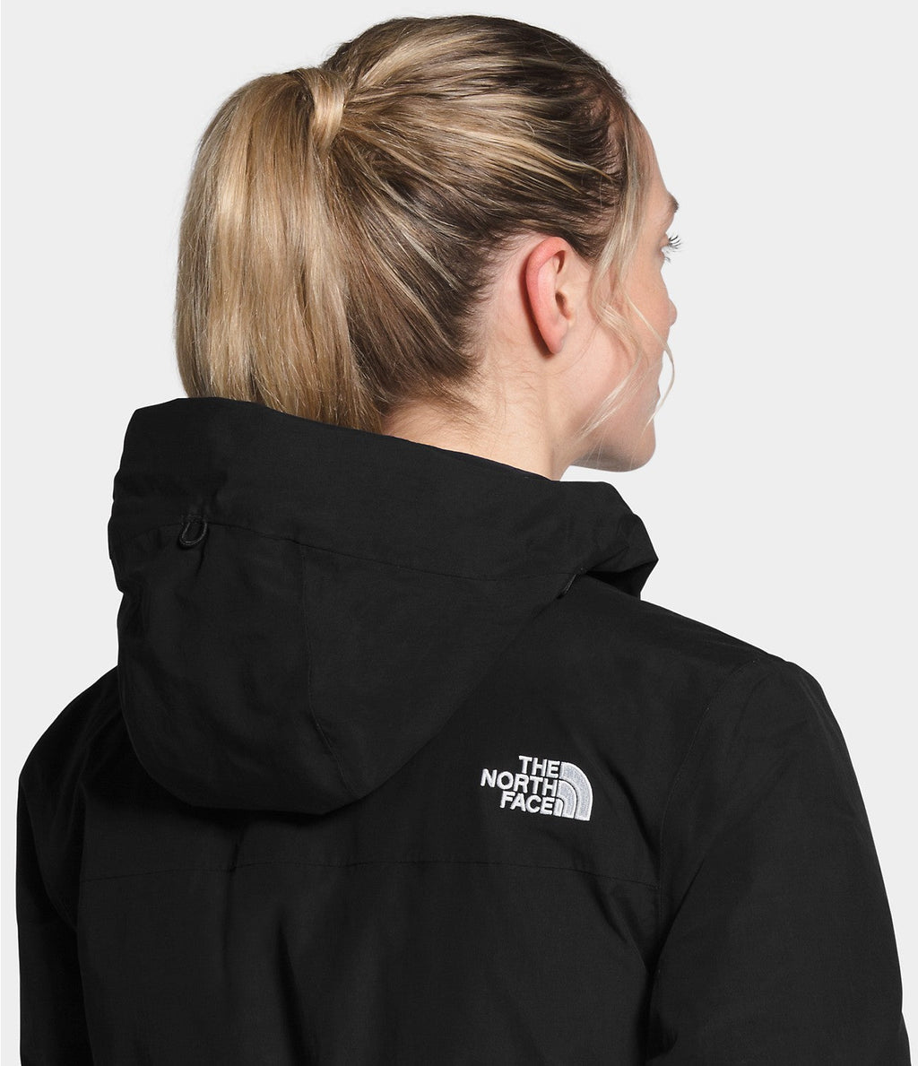 Women’s black Arctic Parka back view with faux-fur hood and logo