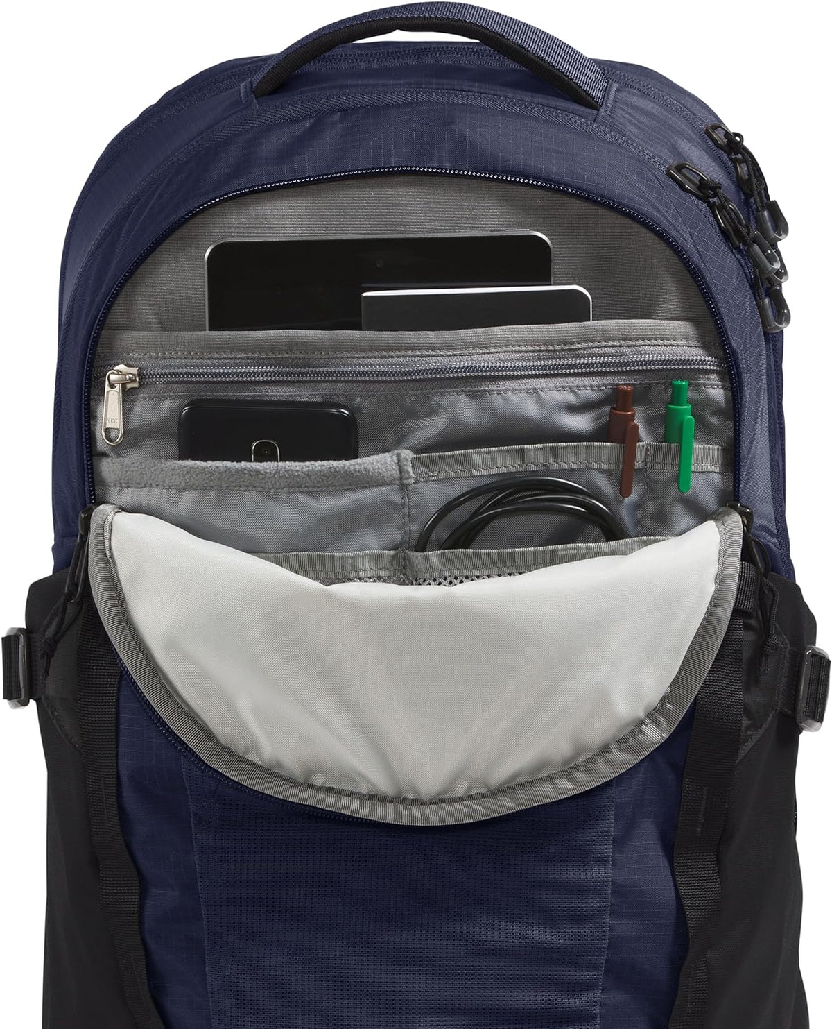 Navy laptop backpack interior with zip organizer pocket and multiple compartments