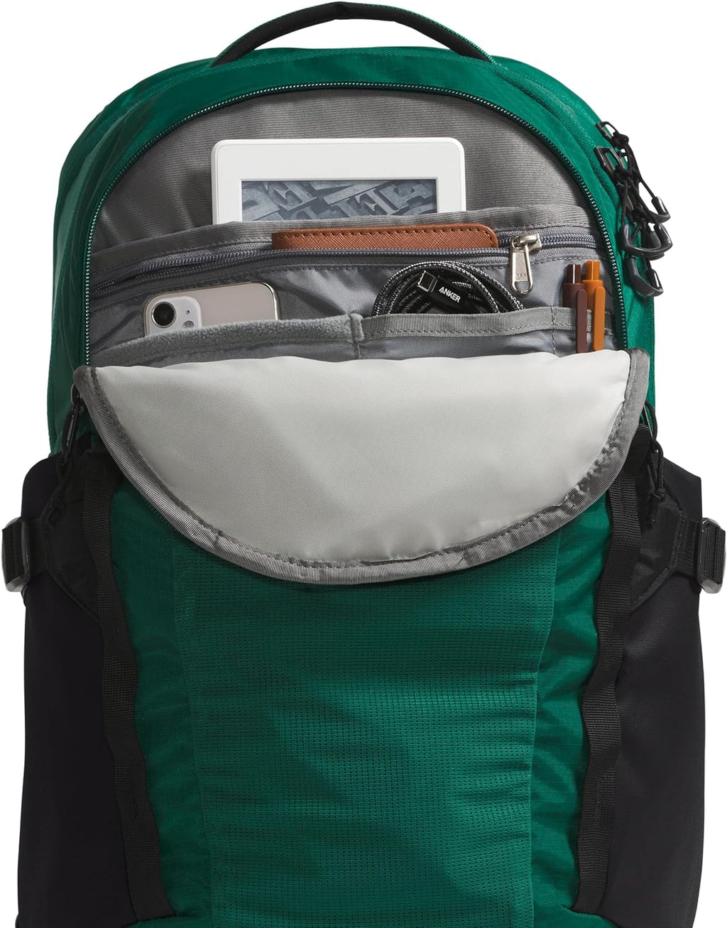Green laptop backpack with open front organizer showing a phone slot and card holder.