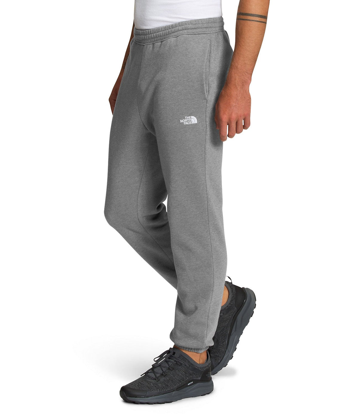 Men's grey heather sweatpants with small TNF logo on thigh and tapered cuffs