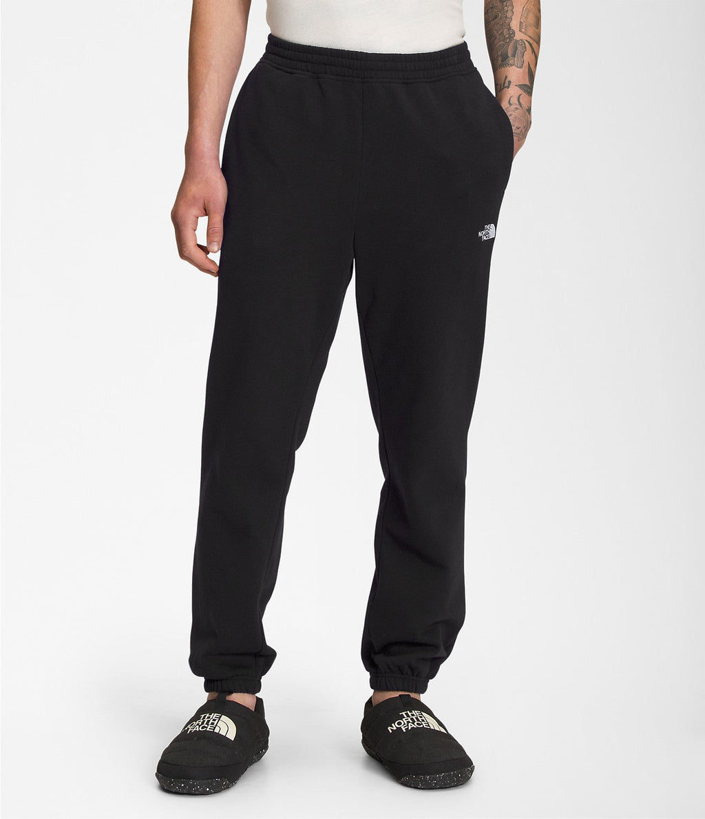 Men's black sweatpants with elastic waistband, tapered ankle cuffs, small logo on thigh