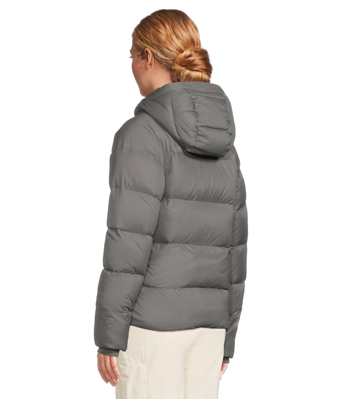 Women’s hooded down puffer jacket in light gray, back view with quilted baffles.