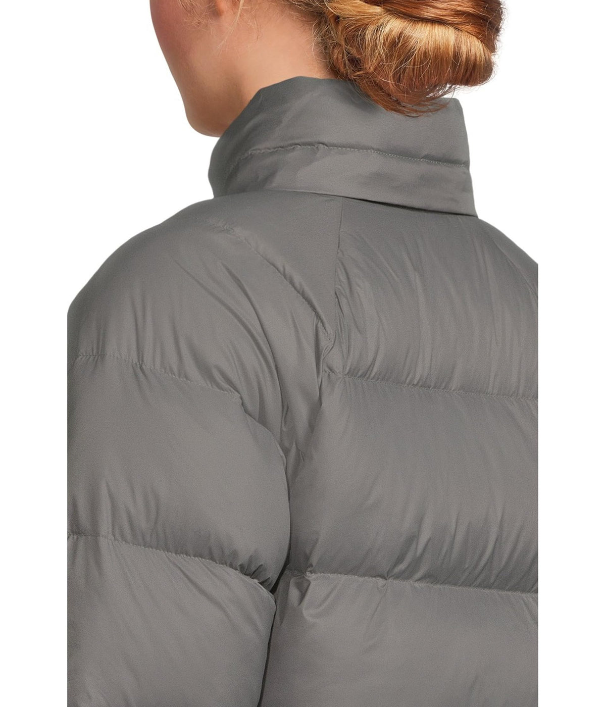 Women’s down hooded jacket in light gray, close-up of quilted insulation on shoulder.