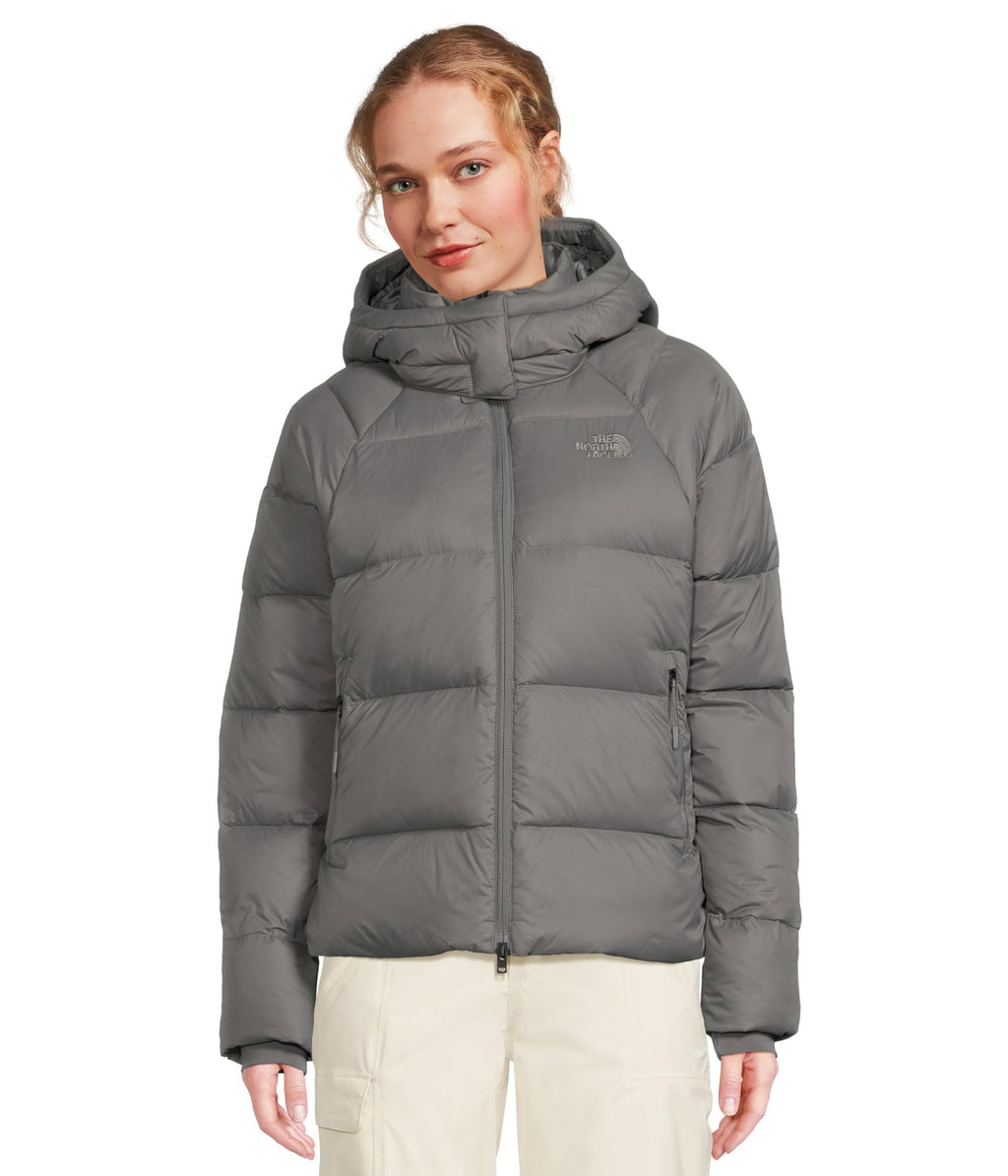 Women’s hooded down puffer jacket in light gray with full-length zipper.