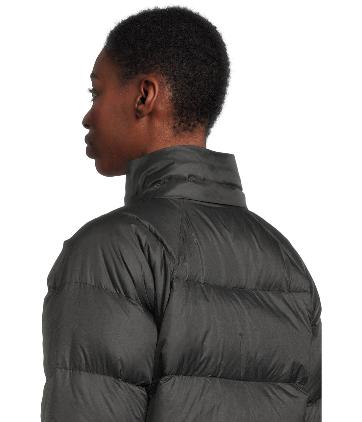 Women’s down hooded jacket in dark gray/black, close-up of quilted baffle pattern.