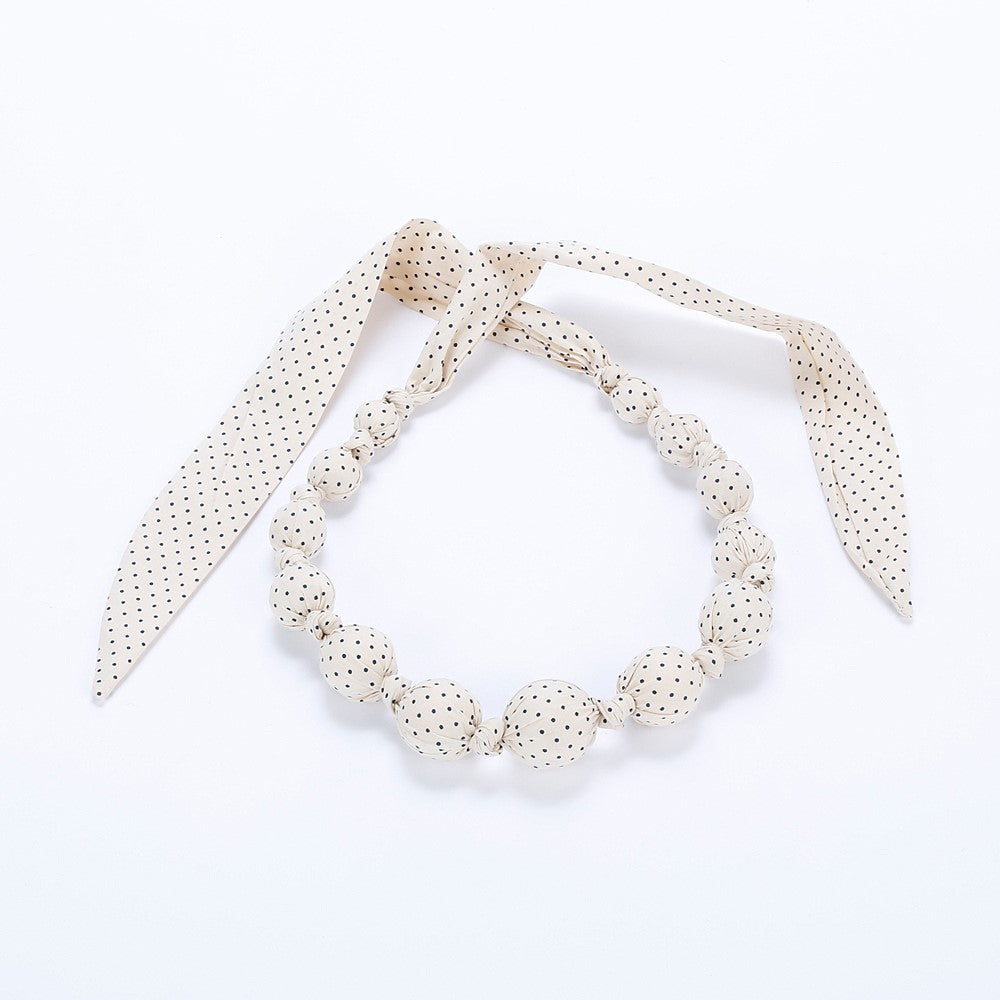 Ivory polka-dot fabric beaded necklace with dangling ribbon bows