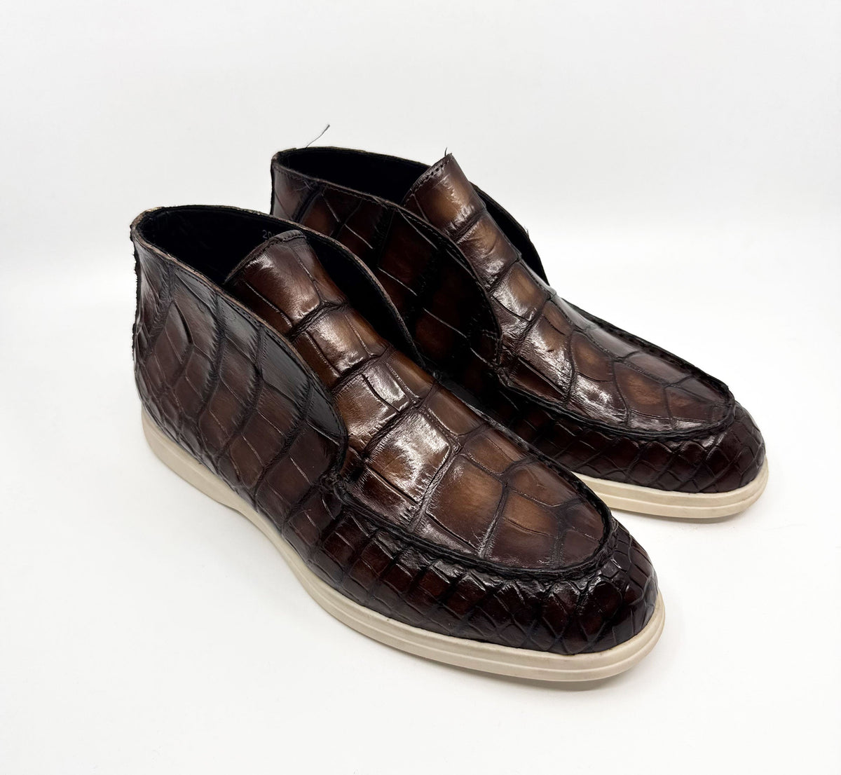 Brown alligator-embossed leather loafers with stitched apron and white rubber soles