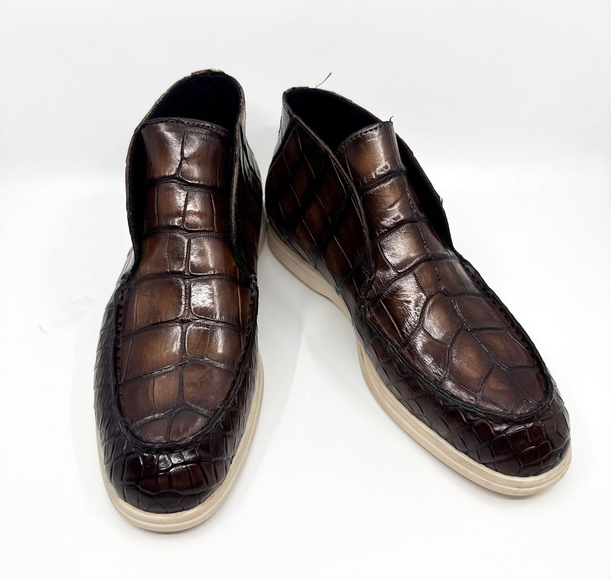 Brown alligator-embossed loafers, side-by-side view with moc toe