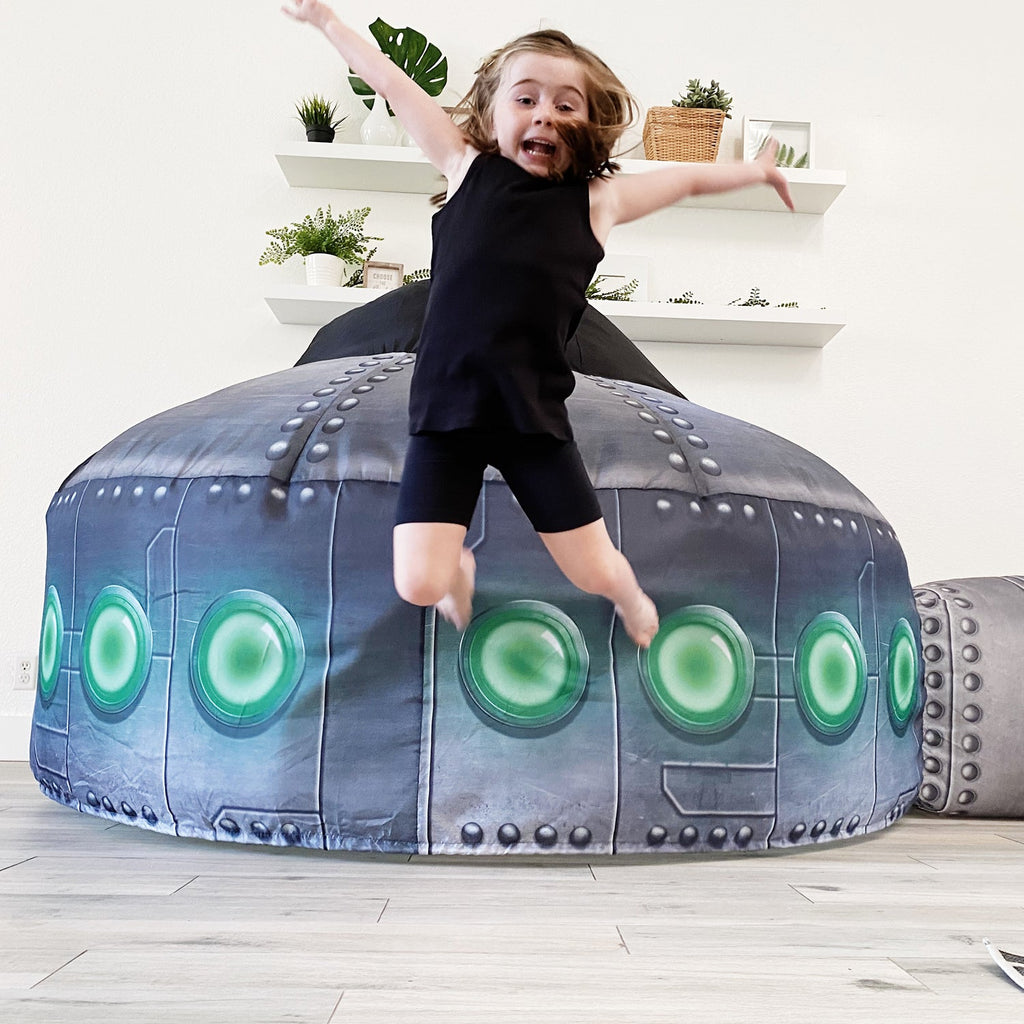 Inflatable UFO play tent with glowing green circles on rounded dome and side tube