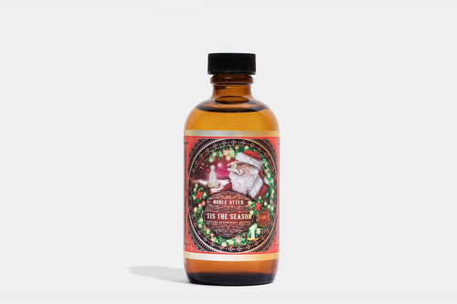 Seasonal holiday aftershave bottle with festive circular label