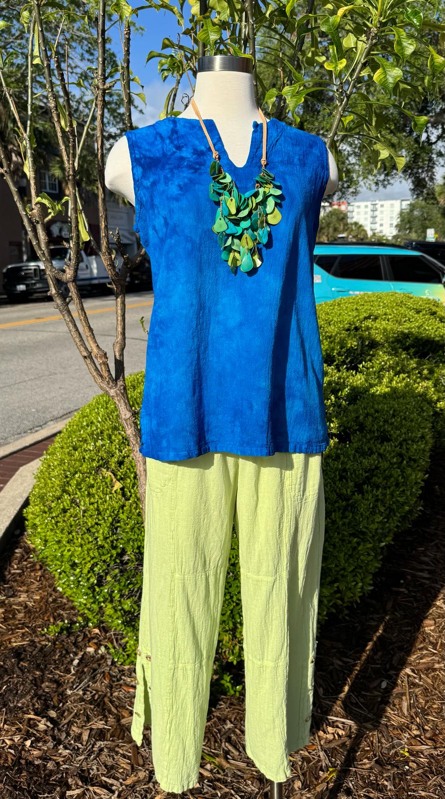 Blue sleeveless cotton gauze top with V-neckline