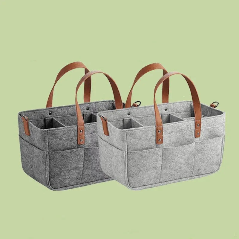 Set of two grey felt storage baskets with brown PU handles and multiple inner sections