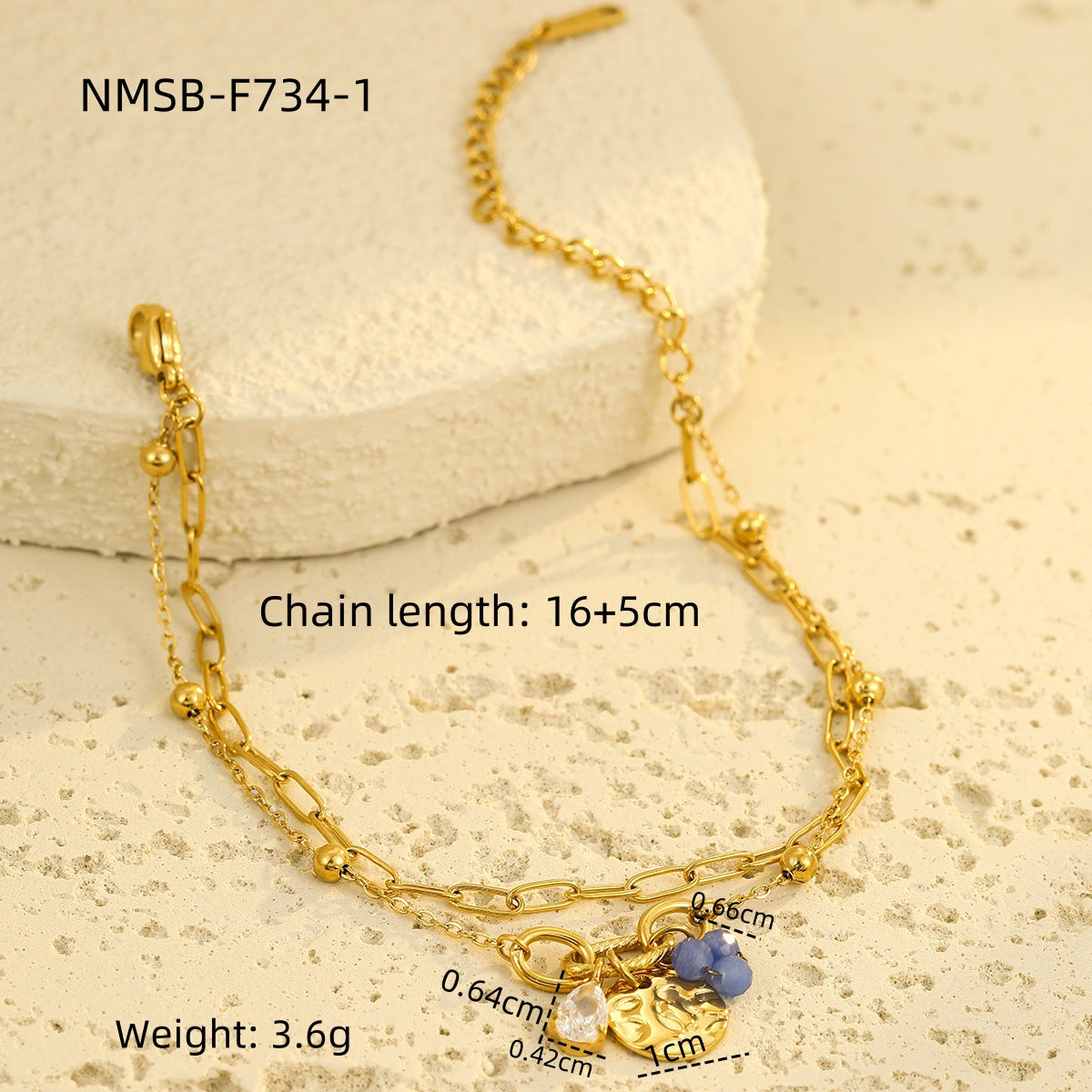 Gold-tone chain bracelet with small bead charms and blue teardrop zircon pendant