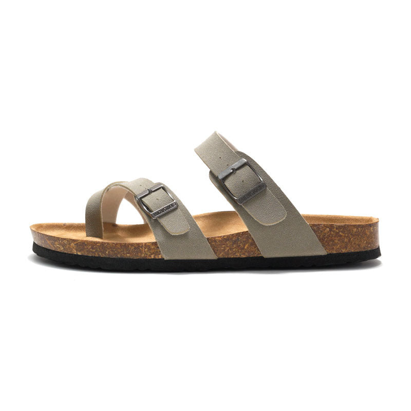 Women's cork sandals in light gray with two adjustable buckle straps, side view.